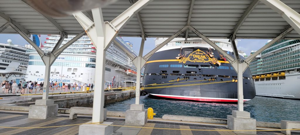 Disney Dream, Carnival Celebration, and Independence of the Seas docked together at the port in Nassau, Bahamas.